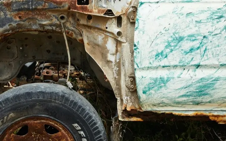 Rusted out front fender